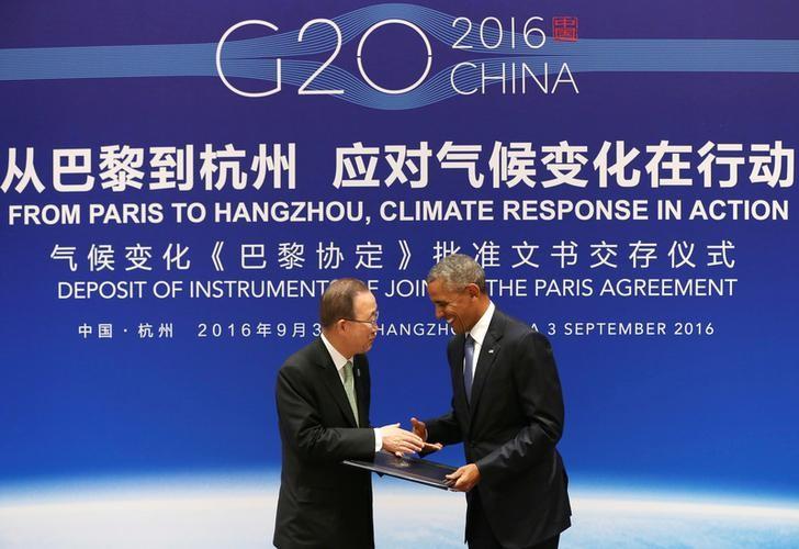 U.S. President Barack Obama (R) shakes hands with UN Secretary General Ban Ki-moon during a joint ratification of the Paris climate change agreement ceremony ahead of the G20 Summit at the West Lake State Guest House in Hangzhou, China, September 3, 2016. REUTERS/How Hwee Young/Pool