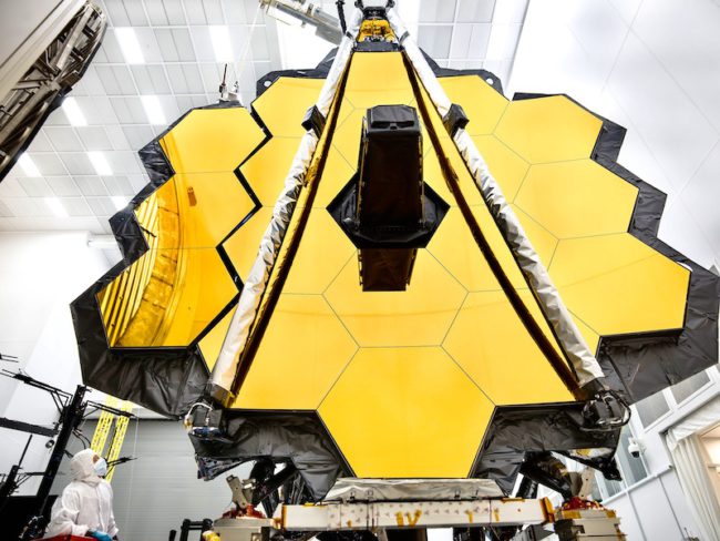 The towering primary mirror of NASA’s James Webb Space Telescope inside a cleanroom at NASA’s Johnson Space Center in Houston.